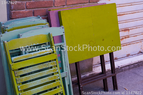 Image of Tables and stairs with different colors on a wall