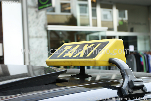 Image of TAXI sign