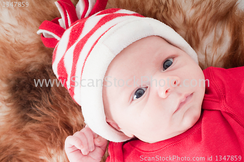 Image of Newborn baby in chritstmas hat