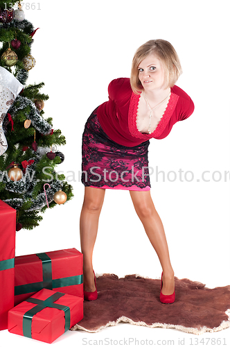 Image of Happy woman with Christmas presents