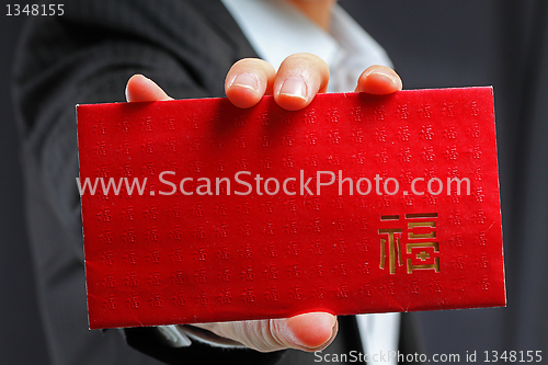 Image of Young man holding an empty lucky pocket in his hand 