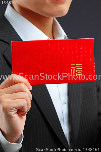 Image of Young man holding an empty lucky pocket in his hand 