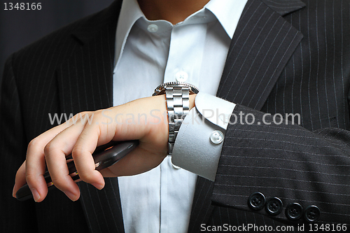 Image of men's hand with a watch. 