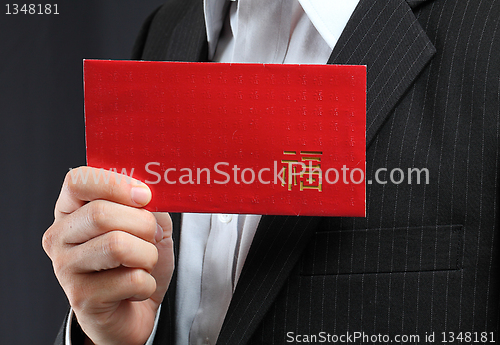 Image of Young man holding an empty lucky pocket in his hand 