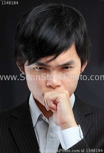 Image of asian man thinking