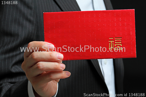 Image of Young man holding an empty lucky pocket in his hand 