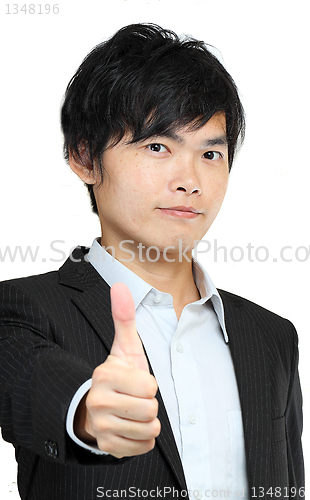 Image of portrait of young man in suit and thumbs up