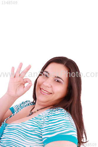 Image of young happy woman giving ok hand sign