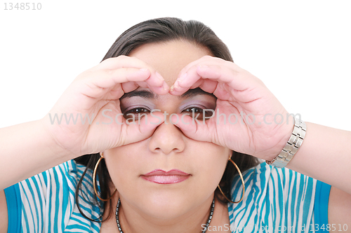 Image of Young woman looking through imaginary binocular 