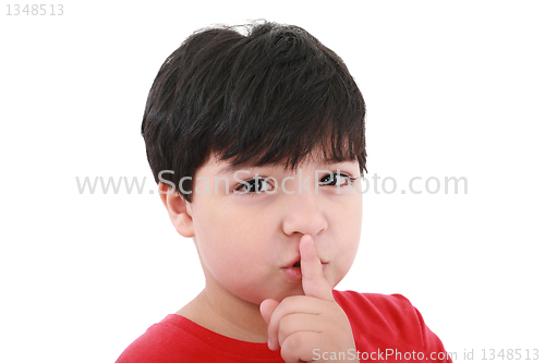 Image of shh. secret - Young boy with his finger over his mouth 