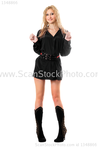 Image of Smiling young woman in black men's shirts