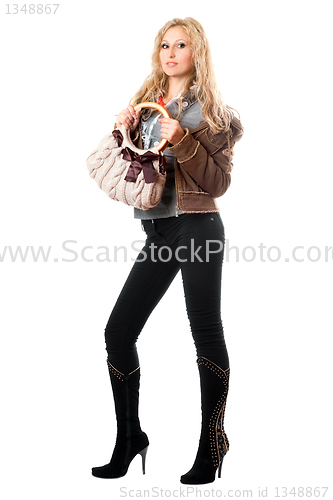 Image of Beautiful playful young blonde with a handbag. Isolated