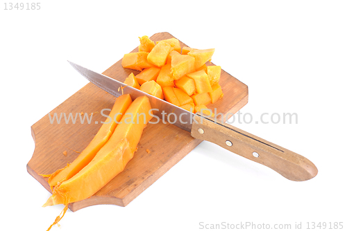 Image of Slices of pumpkin and cutting board and knife , isolated on white background 