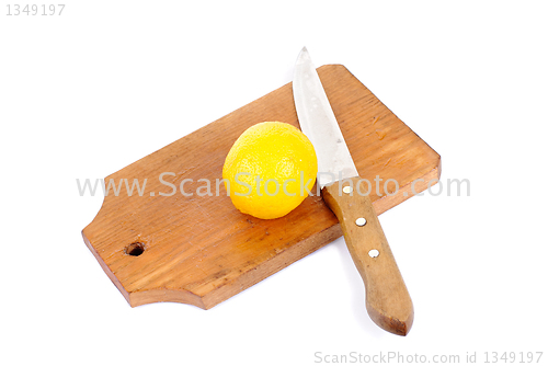 Image of Lemon and cutting board and knife , isolated on white background 