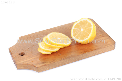 Image of Lemon and  cutting board  , isolated on white background 