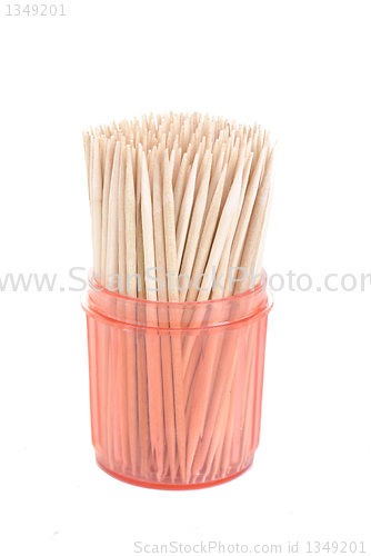 Image of bunch of toothpicks in a red  plastic container isolated on white background 