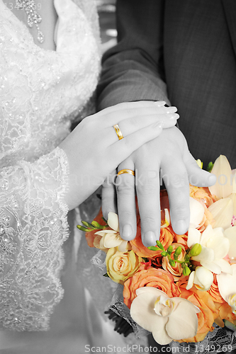 Image of Wedding: hands, rings and bouquet