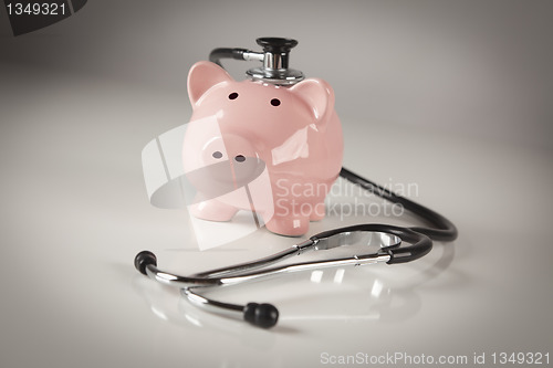 Image of Piggy Bank and Stethoscope with Selective Focus