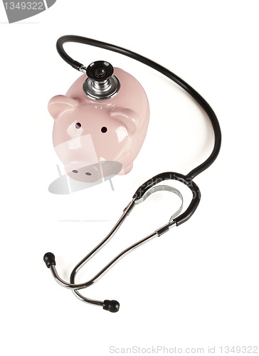 Image of Piggy Bank and Stethoscope Isolated