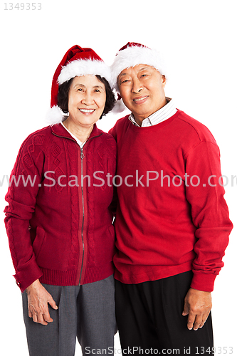 Image of Senior Asian couple celebrating Christmas