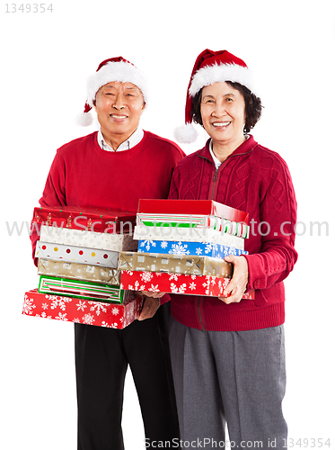 Image of Senior Asian couple celebrating Christmas