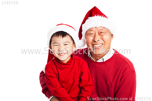 Image of Asian grandfather celebrating Christmas with grandson