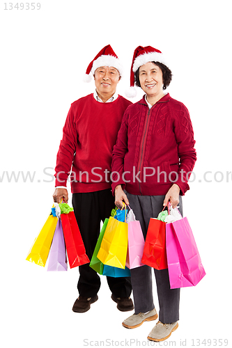 Image of Senior Asian couple celebrating Christmas