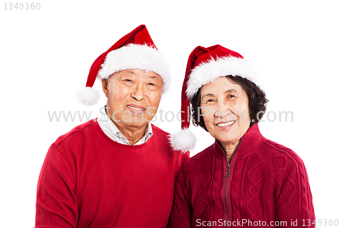 Image of Senior Asian couple celebrating Christmas