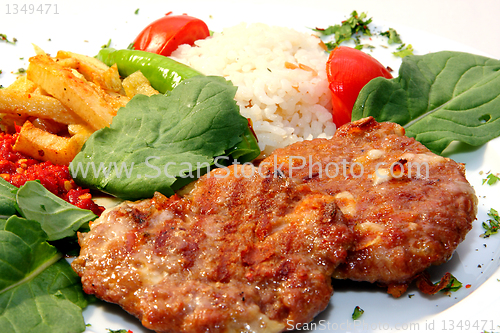 Image of Turkish meatballs with rice and potatoes