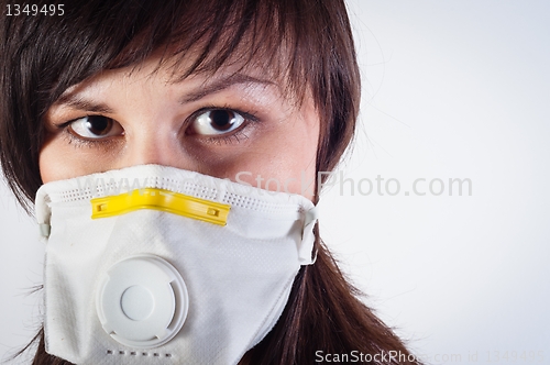 Image of girl wearing protective mask against white background