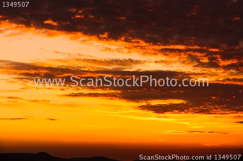Image of Orange sunset with clouds 