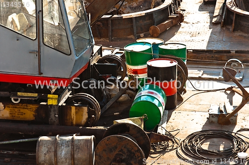 Image of Oil cans on rusty metal surface