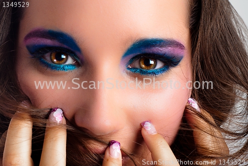 Image of Young model with colorful makeup