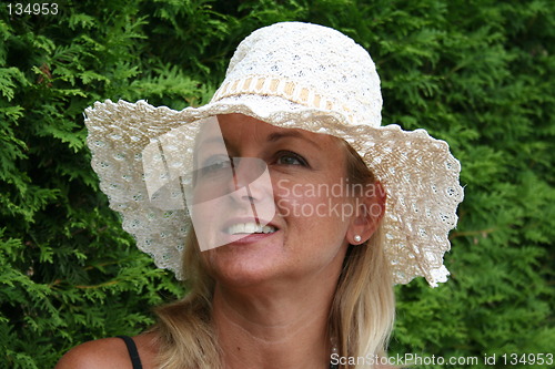 Image of Woman in white hat