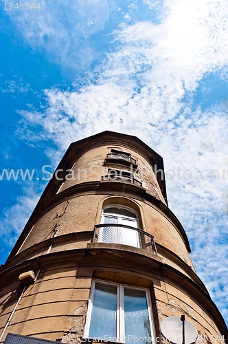 Image of Angle shot of a tall building with blue sky