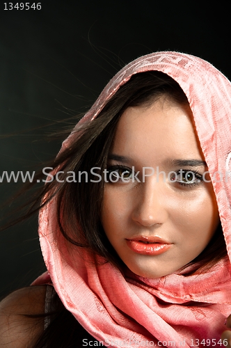 Image of Closeup of a beautiful girl in scarf
