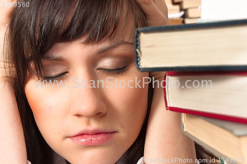 Image of Young student has a lot to study this semester