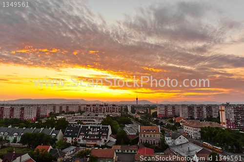 Image of HDR image of a city with silhouettes of mountains