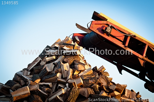 Image of Firewood comes out of a machine