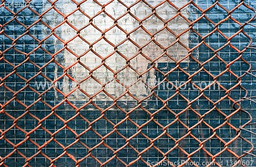 Image of Metal fence on closed down building