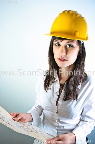 Image of An architect woman holding plans