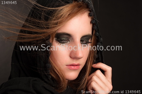 Image of Black makeup and hood on a beutiful young girl