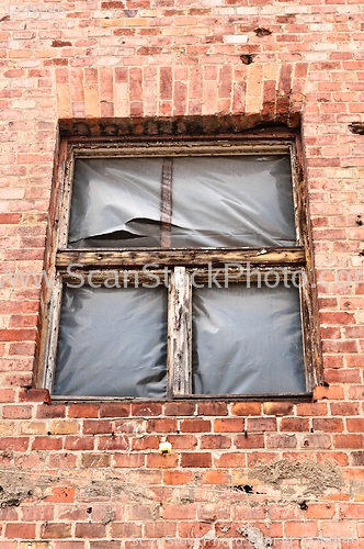 Image of Part of an industrial building with broken window