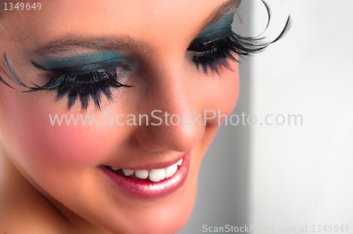 Image of Closeup of a pretty girl with extreme makeup