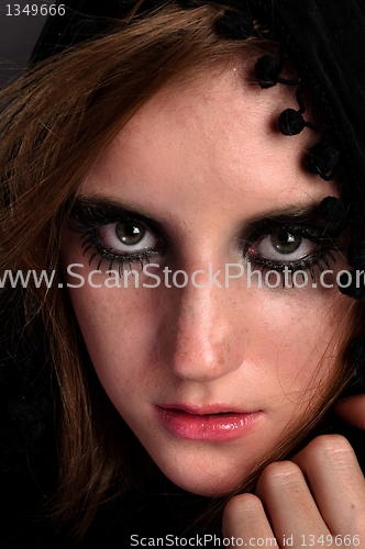 Image of Sad girl in black hood
