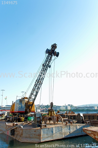 Image of A big crane on boats in a construction