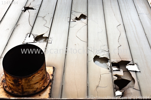 Image of Broken glass and ventilation fan on abandoned industrial buildin