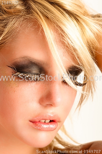 Image of Beautiful makeup on an attractive girl against white background