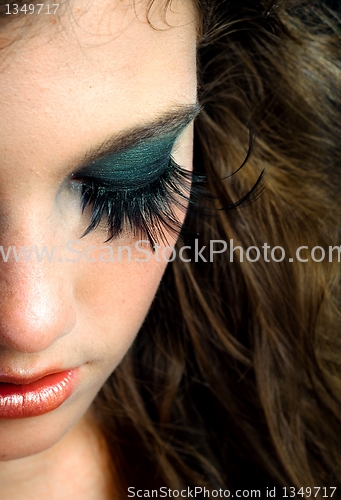 Image of Portrait of a young fashion modell against dark background