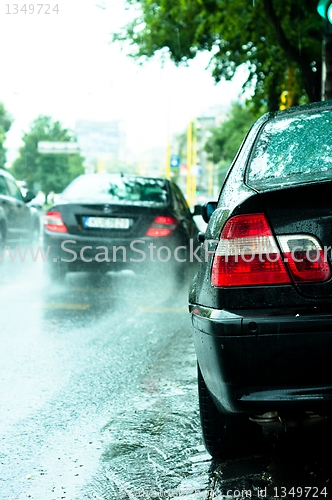 Image of Parked car in rain with blurry background